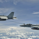 An F/A-18F two-seat Super Hornet refuels an F/A-18E Super Hornet over the Bay of Bengal in 2007 (US Navy)